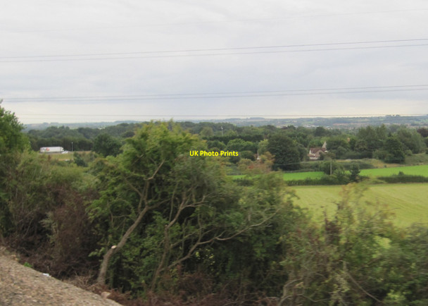 Photo 6"x4" View from a Bristol-Cheltenham train - farmland and woodland near the M4 Pye Corner\/ST6479 c2015