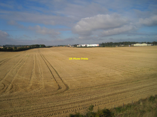 Photo 6"x4" View from a Newcastle-Edinburgh train - the edge of Dunbar Dunbar c2015