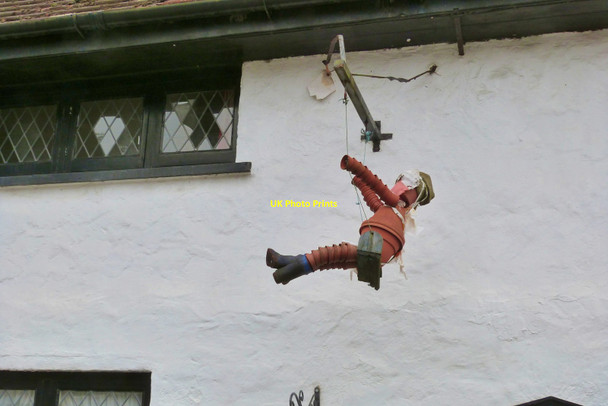 Photo 6"x4" Flowerpot man on a swing in the picturesque village of Berrynarbor, Devon Berrynarbor c2018