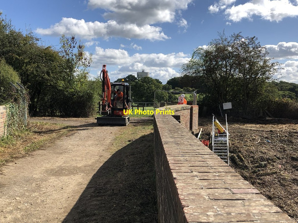 Photo 6"x4" Digger crossing the railway bridge Burgess Hill c2018