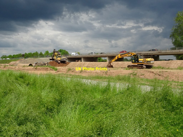 Photo 6"x4" Excavators under a heavy sky Powick c2019