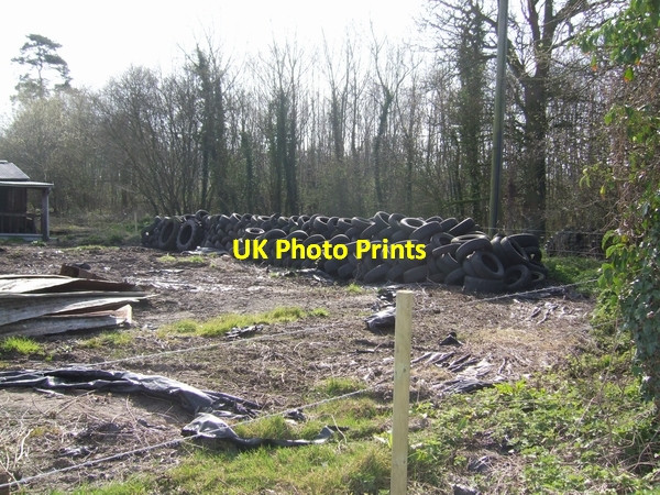 Photo 6"x4" Tyres in the farmyard Woollaston c2007