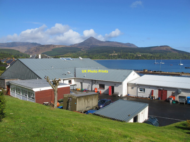 Photo 6"x4" Shop buildings in Brodick, with view across the bay Brodick c2010
