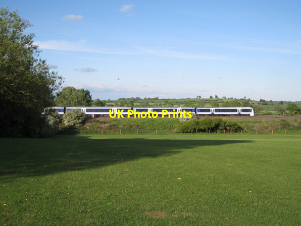 Photo 6"x4" Train passing golf practice ground Whitnash c2010