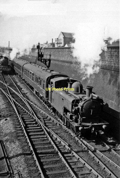 Photo 6"x4" Old Oak Common East: a '9700' class 0-6-0PT sets off for Paddington, while a light engine returns to the Locomotive Depot. Kensal Town c1961