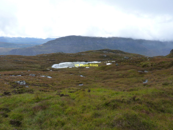 Photo 6"x4" Small, shallow lochan on the southern side of Creag nam Feuaich Carn nam Feuaich c2011