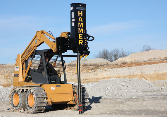Skid Steer Post Driver Attachment With Power Tilt and Grapple (One Man Operation) Skid Steer Post Driver Attachment With Power Tilt and Grapple (One Man Operation)
