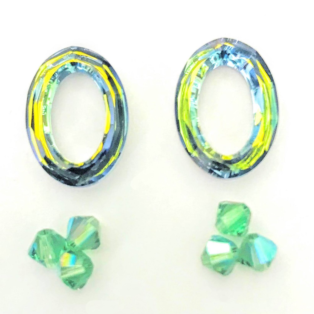 swarovski-4137-22mm-oval-ring-beads-crystal-sahara-and-erinite-shimmer.jpg