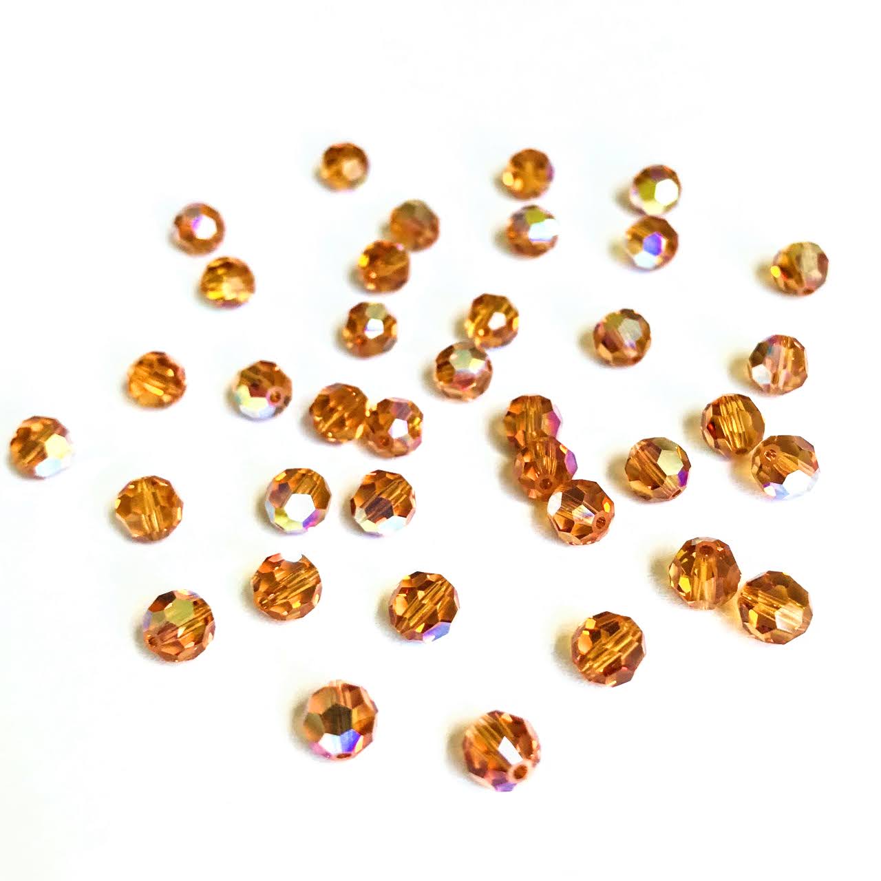 swarovski-crystal-beads-crystal-copper-5000-rounds-topaz-ab.jpg