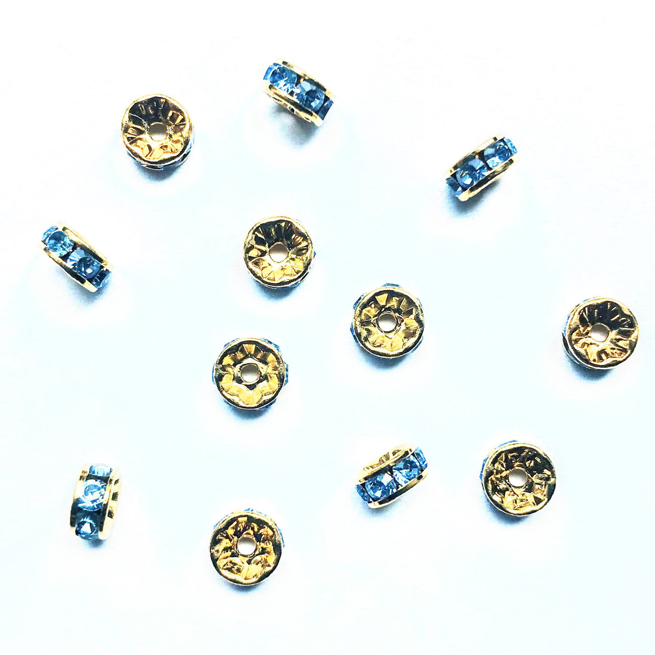 swarovski-crystal-rhinestone-rondelles-gold-light-sapphire-1-35603.jpg