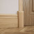 Americraft Solid Hardwood Stain Grade Smooth Plinth Block with Beveled Edge - Installed