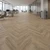 Blues Herringbone SPC Vinyl Flooring Planks - 29.5 in x 5.9 in - King Oak - Covers 16.94 sq. ft. per pack - Installed Image