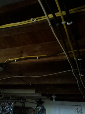 ceiling-trusses-with-exposed-electrical-wires.jpg