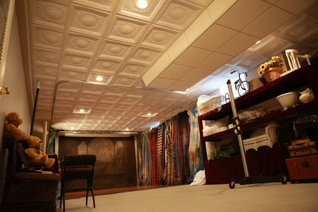 Diana Aliprandi has turned her basement into a photogrpahy studio and used decorative ceiling tiles for her ceiling.