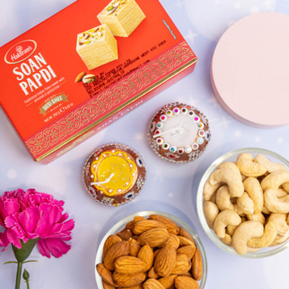 Diwali Celebration With Sweets Nuts And Diya