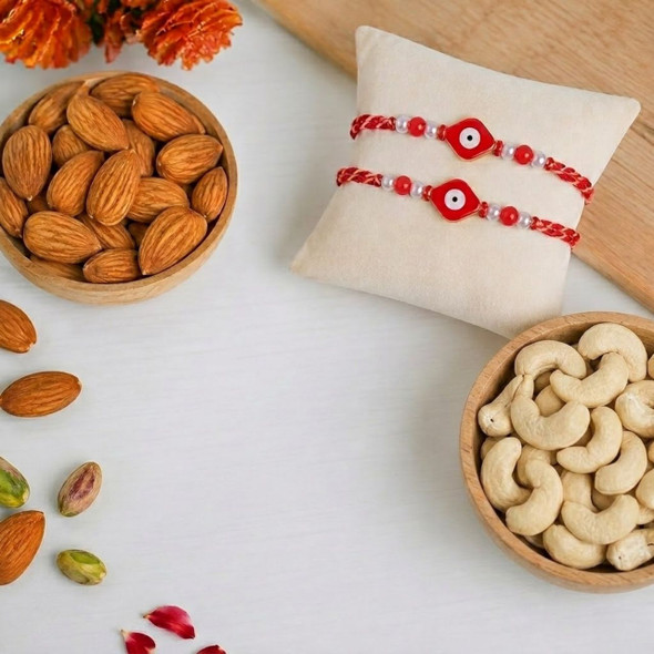 Two Evil Eye Pearl Design Rakhi  With Almonds & Cashews