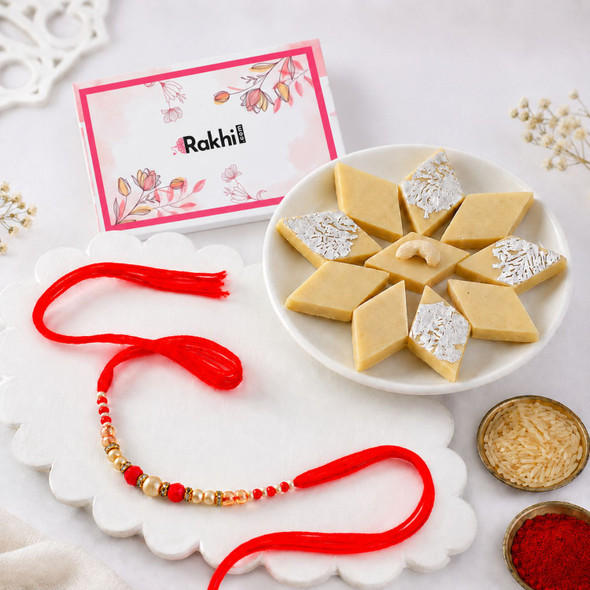 Elegant Pearl & Crimson Beaded Rakhi with Kaju katli