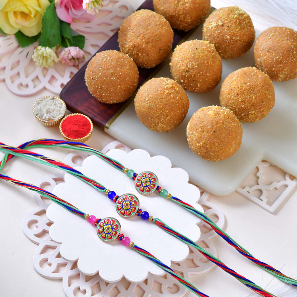 Designer Triplex Rakhi and Besan Ladoo Gift