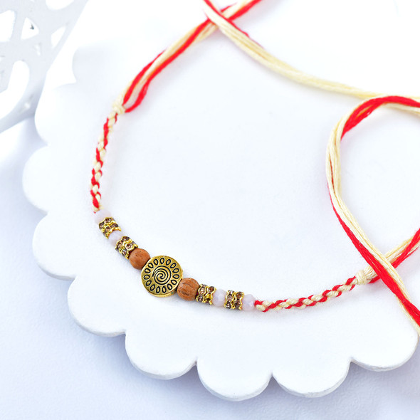 Elegant Antique Gold Charm Rakhi