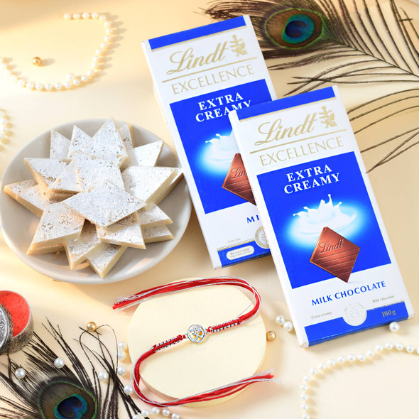 Pure Silver Om Rakhi with Kaju Katli & Lindt Chocolates