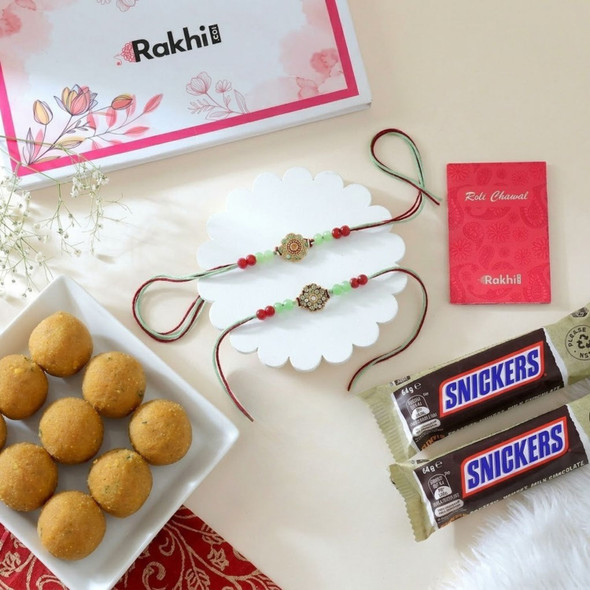 Two Beautiful Rakhis Sweet & Snickers Delight