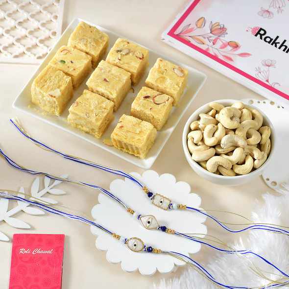 3 Evil Eye Rakhi Set With Soan Papdi and Nuts