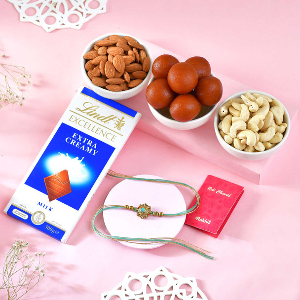 Regal Mint Mandala Rakhi With Sweet Dryfruits Hamper