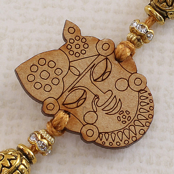 Engraved Tribal Art Face Rakhi