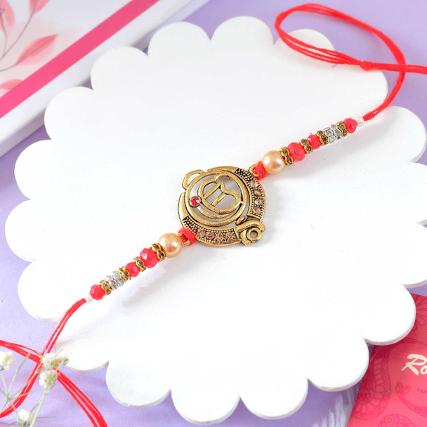 Traditional Designer Rakhi with Om Symbol and Beaded Work