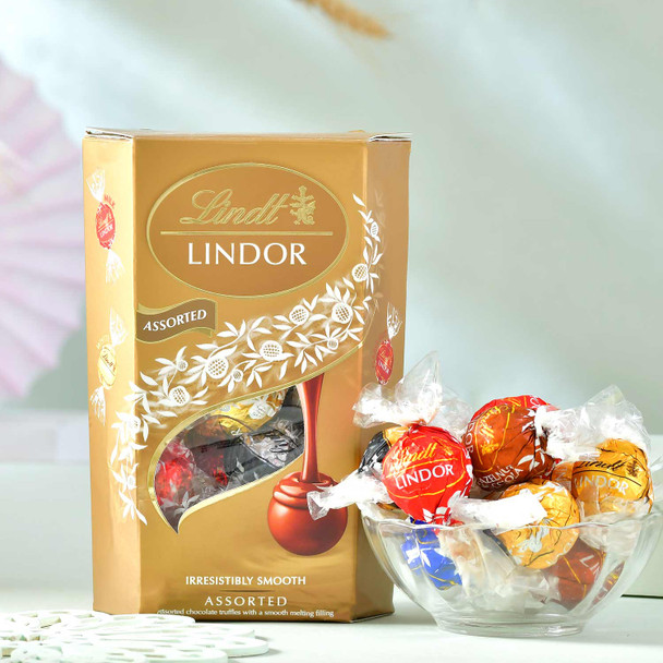 Attractive Two Rakhi with Ferrero Rocher and Lindor Assortment Chocolates