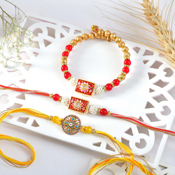 Elegant Rakhi Trio with Gourmet Treats