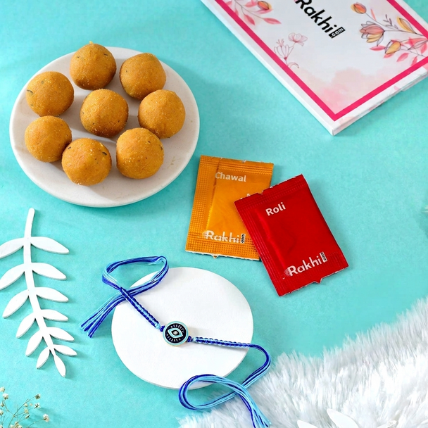 Charming Evil Eye Protection Rakhi With Besan Laddu