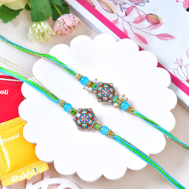 Two Designer Blue Rakhi Set With Besan Laddu