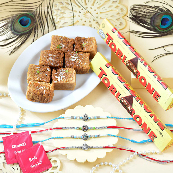 Set of Four Divine Rakhi With Milk Cake & Toblerone Chocolates
