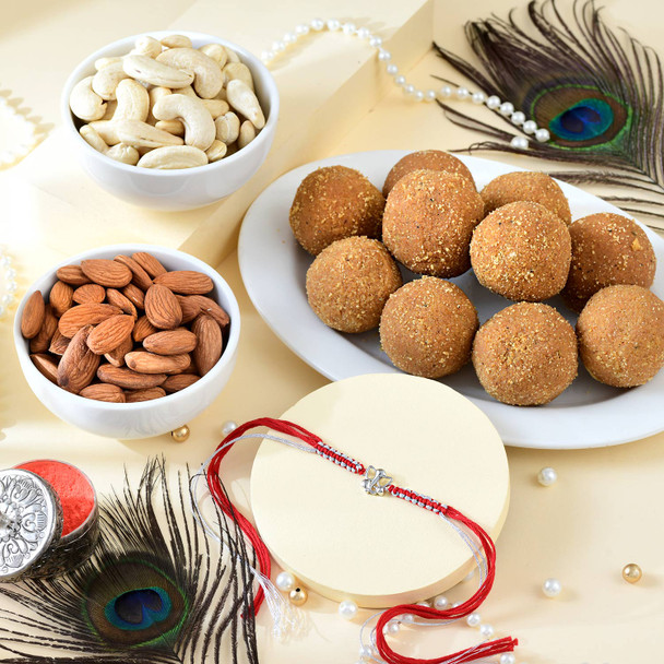 Shree Ganesha Pure Silver Rakhi with Sweet & Nut Combo