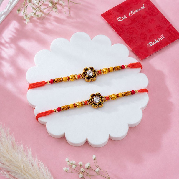 Elegant Diamond Flower Rakhis with Gourmet Hamper