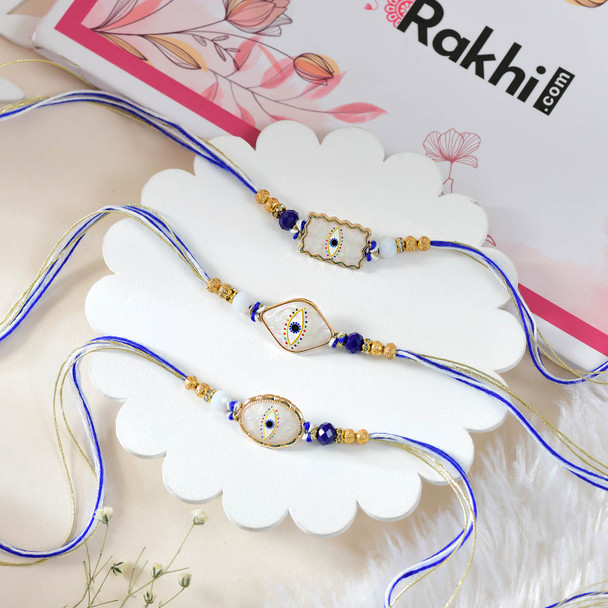 3 Evil Eye Rakhi Set With Soan Papdi And Cashew
