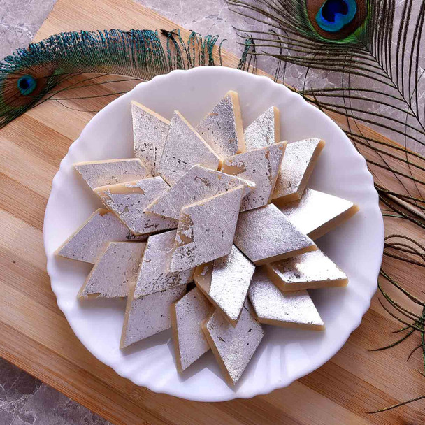 Bluish Rakhi with Kaju Katli and Almonds.