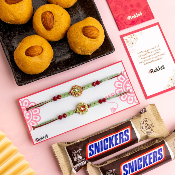 Green Beaded Rakhi Set with Besan Laddu and Snickers.