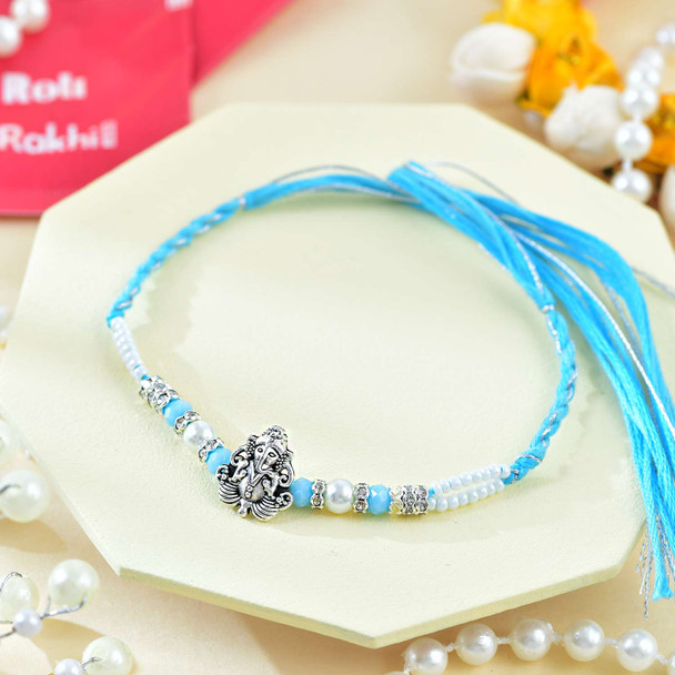 Religious Ganesha And Suriya Dev Rakhi Set