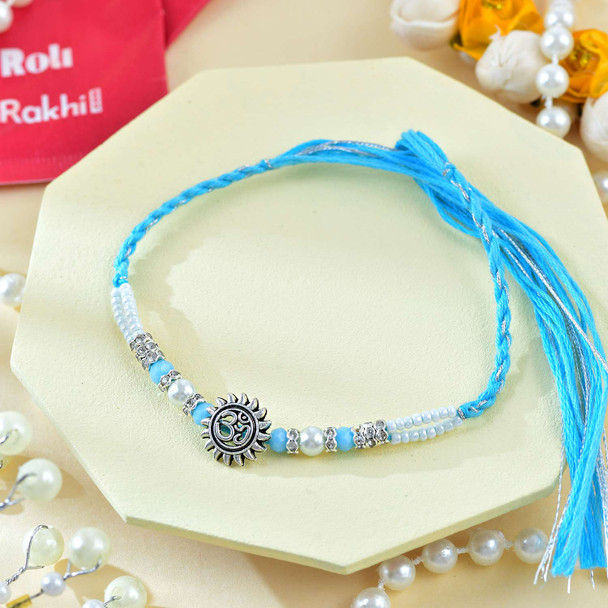 Religious Ganesha And Suriya Dev Rakhi Set