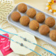 Ganesh And Suriya Set Of Two Rakhi With Besan Laddu