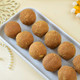 Ganesh And Suriya Set Of Two Rakhi With Besan Laddu
