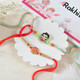 Little Krishna And Ek Onkar Rakhi Hamper