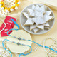 Ganesh And Suriya Set Of Two Rakhi With Kaju Katli
