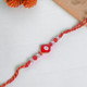 Two Evil Eye Pearl Design Rakhi  With Almonds & Cashews