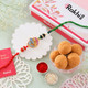 Divine Ganesha Rakhi with Besan Ladoo Combo