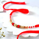 Elegant Pearl & Crimson Beaded Rakhi for Brother
