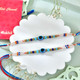 Two Evil Eye Rakhi with Gourmet Hamper