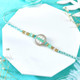 Turquoise Designer Rakhi With Kaju Katli And Ferrero Rocher